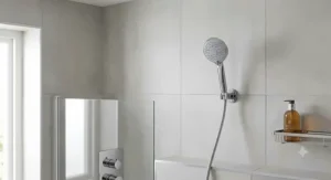 A successfully completed DIY shower head replacement connected to a classic British mixer shower valve.