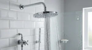 A large fixed rainfall shower head for low water pressure designed to boost spray power in traditional mixer showers.