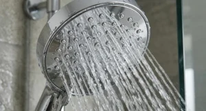 Close up of micro-nozzle technology on a chrome shower head that increases pressure for low-pressure UK plumbing