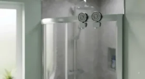 Close-up of a sliding door quadrant shower cubicle showing smooth rollers and glass finish
