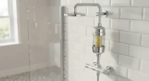 A vitamin C shower filter device fitted in a modern British bathroom to help combat the effects of hard water