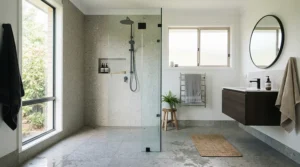 A seamless anti-slip shower tray for elderly residents integrated into a contemporary wet room