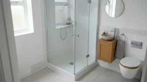 A space-saving shower tray under £150 fitted inside a compact British terraced house en-suite
