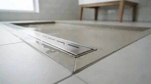Ultra-thin white shower tray featuring a sleek concealed waste drainage cover