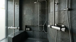 Surface-mounted pipework connecting to a modern chrome exposed shower valve